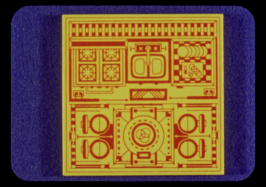 A yellow box with red designs sits over purple.
